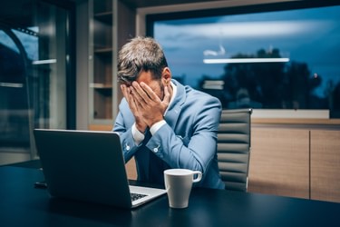 Stressed businessman in office